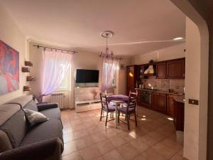 a living room with a couch and a table at A.B Battistini Short Let's in Rome