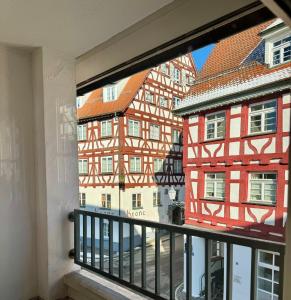 a view from a balcony of a building at Traumhafte Wohnung am Stadtbrunnen der Altstadt in Pfullendorf