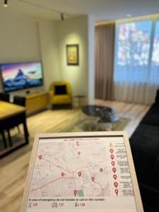 a map of a room with a living room at Exquisite by Broci Apartments in Tirana