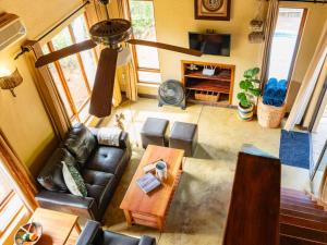 an overhead view of a living room with a couch and a table at Impala Cottage in Hoedspruit