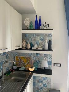 A kitchen or kitchenette at Villa NOVE - Residence dei Fiori