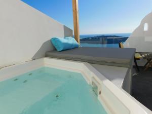 a swimming pool on the deck of a boat at Fira Caldera Suites in Fira