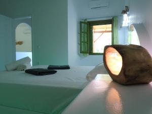 A bed or beds in a room at Leros Eleonas ApartmentS