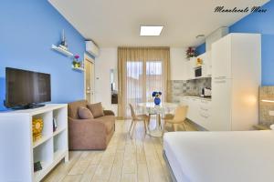 TV a/nebo společenská místnost v ubytování Casa Stefania Rimini