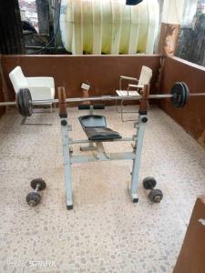 aption of a barbell and a chair in a room at 2 bedroom Bungalow @ St John in Mount Aureol