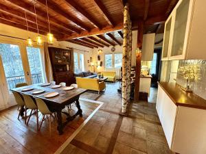 a kitchen and dining room with a table and chairs at Gavarent in Gavarnie