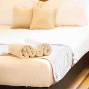 Postel nebo postele na pokoji v ubytování Byblos Comfort Hotel