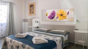 Posteľ alebo postele v izbe v ubytovaní Cala Gonone house