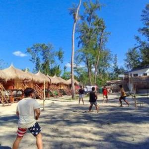 a group of people playing a game of volleyball at BALI OF LIWA LAGOON BAR & BEACH RESORT in San Felipe