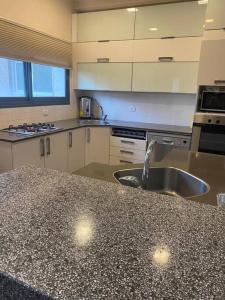 a kitchen with a sink and a counter top at Golden key in Jerusalem