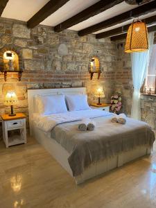 מיטה או מיטות בחדר ב-Ionia Liberty Stone