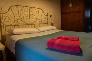 Postel nebo postele na pokoji v ubytování B&B Etico La Casa di Toti