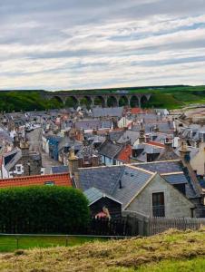 a view of a town with a bridge in the background at Cullen Holiday Home in Cullen