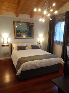 Una cama o camas en una habitación de B&B Melograno MC