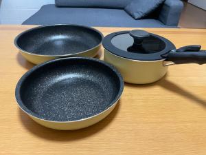 two pots and pans sitting on a table at Happy House- TAKAMATSU in Takamatsu