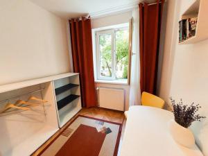 a small room with a table and a window at Sunflower apt in Timişoara