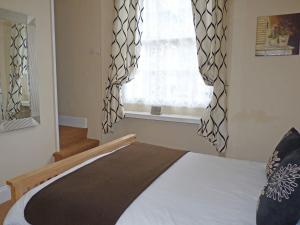 A bed or beds in a room at Town Mills 