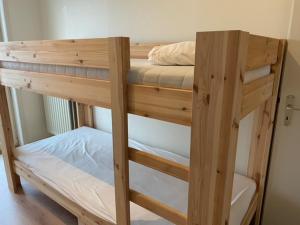 a couple of bunk beds in a room at Kristof701 in De Panne