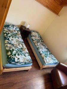 Tempat tidur dalam kamar di 3-Zimmer Maisonette-Wohnung