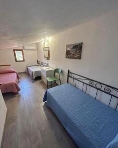 Postel nebo postele na pokoji v ubytování Residence Melograno