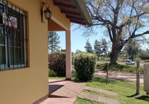 a side view of a house with a window at Bungalows El Zarateno in Colón