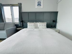 מיטה או מיטות בחדר ב-Qing Taoyuan Homestay
