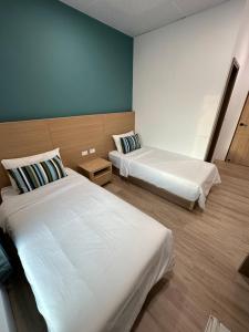 מיטה או מיטות בחדר ב-Qing Taoyuan Homestay