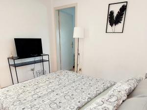 מיטה או מיטות בחדר ב-I love Vicenza Apartment