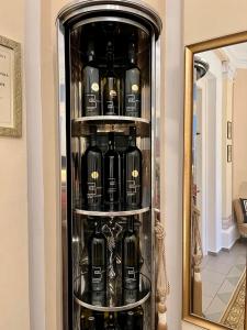 a display case filled with bottles of wine at Penzion Vila Julie in Jilemnice