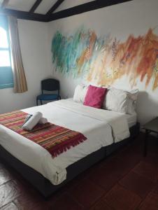 Postel nebo postele na pokoji v ubytování Hotel FLORA Suesca