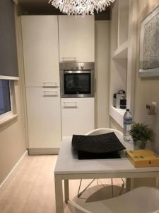 a kitchen with a table with a keyboard on it at Cosy and Renewed T2 Apartament in Campolide - 67 1D in Lisbon