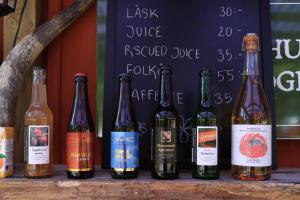 a group of bottles of wine sitting on a table at Grinda Stugby och Sea Lodge - Pensionat med kost & logi in Grinda