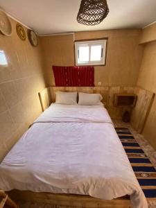 a bedroom with a large white bed in it at Sable beach surf camp taghazout in Taghazout