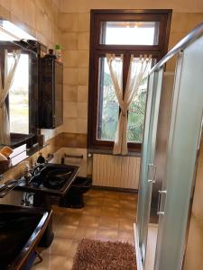 a kitchen with a sink and a window at Villa Carla - Camera King Superior in Padova