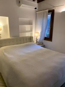 Кровать или кровати в номере Ca' Olivolo 1891 in Biennale