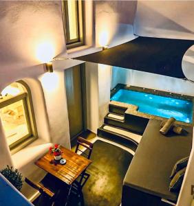 an overhead view of a house with a swimming pool at Tiara Suites Santorini in Fira