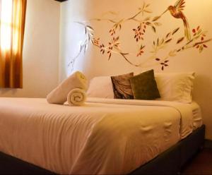 Postel nebo postele na pokoji v ubytování Hotel FLORA Suesca