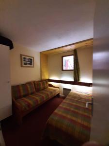Postel nebo postele na pokoji v ubytování Le RUITOR