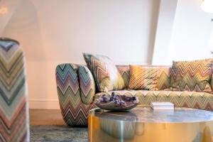 a living room with a couch and a table at La Butte aux Bois in Lanaken