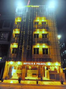 a large building with yellow lights on top of it at HOTEL R K PALACE in Bhopal