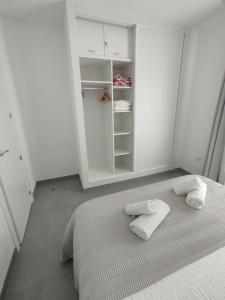 A bed or beds in a room at Residencial los Pinos 3
