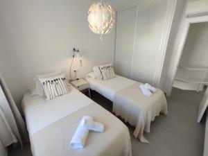 A bed or beds in a room at Residencial los Pinos 3