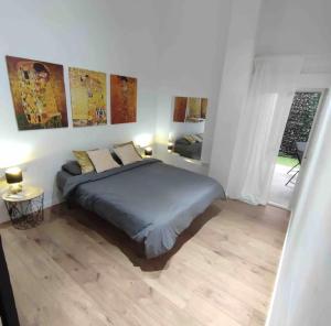 a white bedroom with a bed and a window at Bear Homes - Olimpia Suite in Valencia