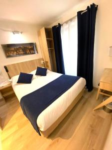 Кровать или кровати в номере Hôtel Mazagran