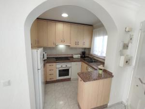 A kitchen or kitchenette at Residencial los Pinos 3