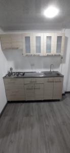 a kitchen with a sink and a counter top at Apartamento vía a termales in Santa Rosa de Cabal