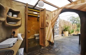 a bathroom with a toilet and an open door at Studio Mazo La Cuevita in Mazo +51 photos