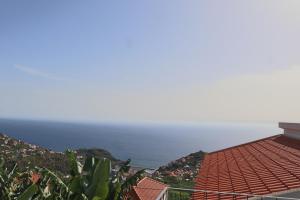 a view of the ocean from a house at Fifty's House 2 in Ribeira Brava