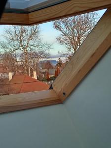 a view from a window of a roof at Lokomotív Apartman in Balatonmáriafürdő +5 photos