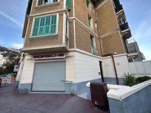 a building with a garage on the side of it at NEW Studio, 2mn walk to Monaco in Beausoleil